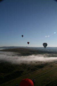 Hot air Balloons Over Clouds