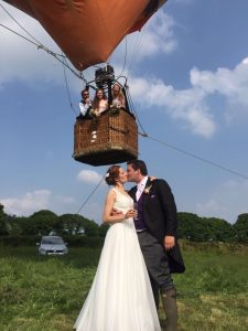 wedding in front of tethered balloon