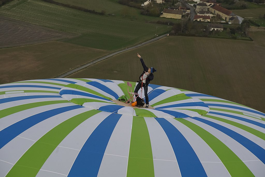 remi ouvrard standing on top of balloon